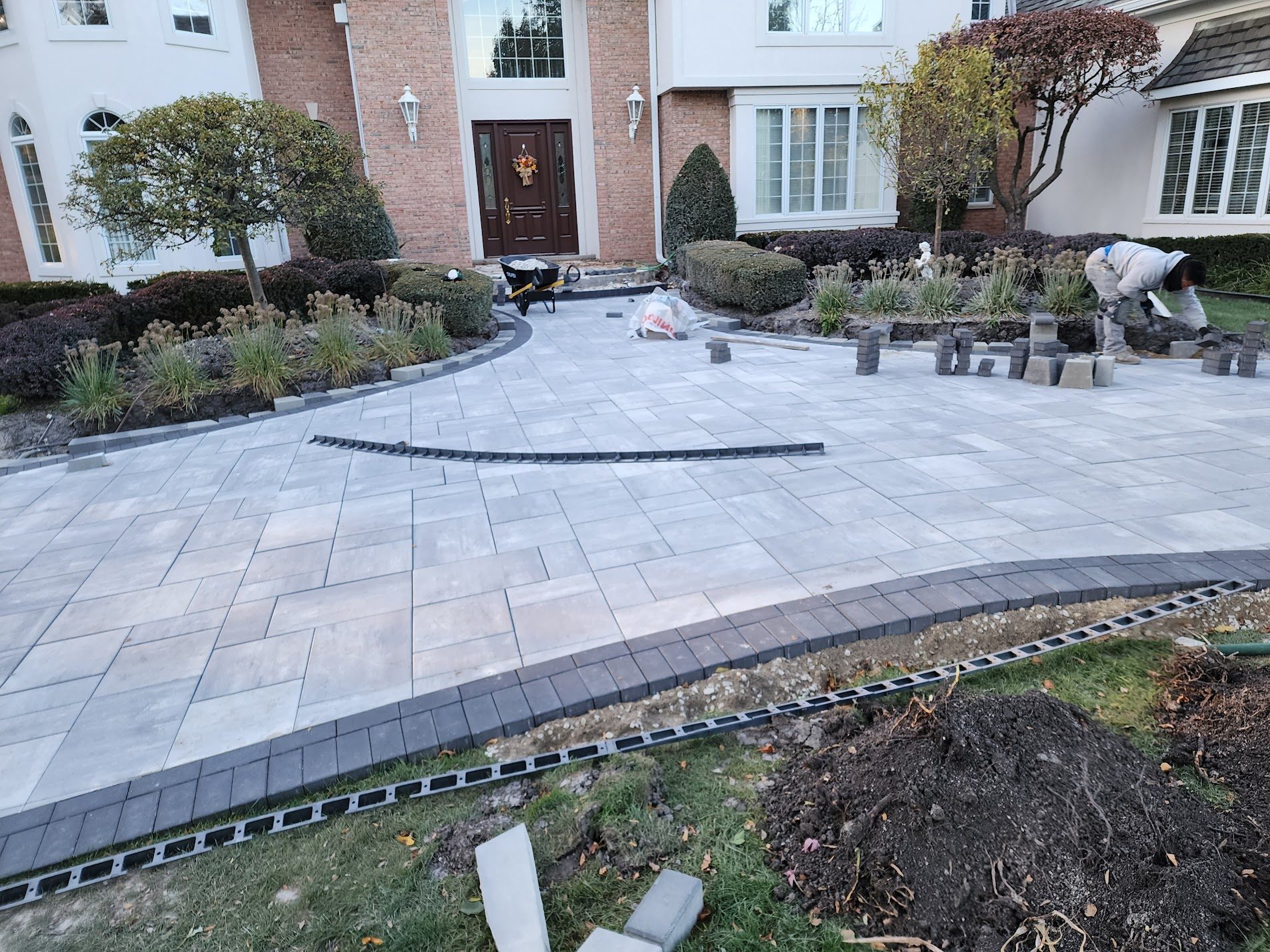 Large paver patio with curved border