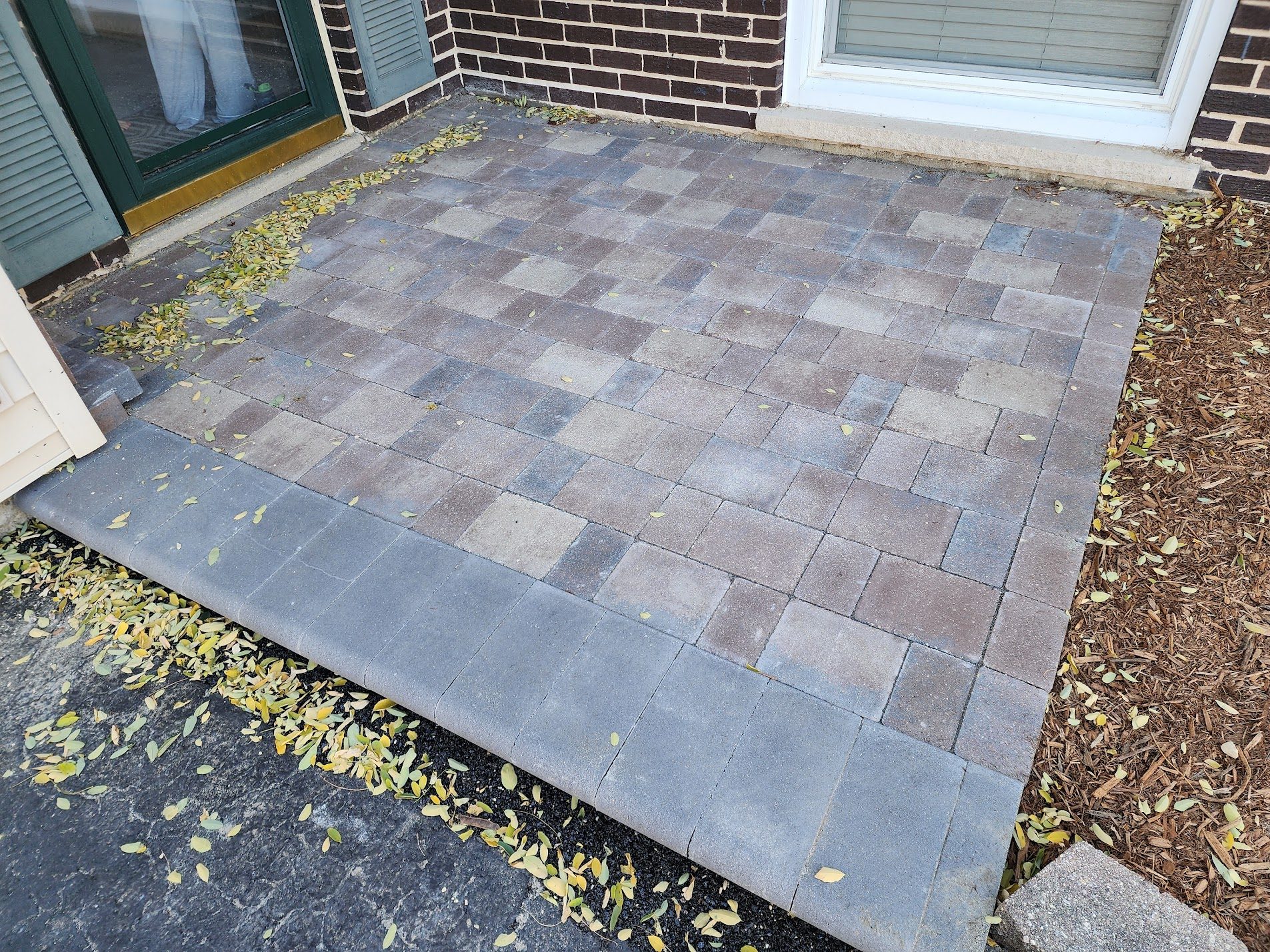 Rectangular paver patio with dark border