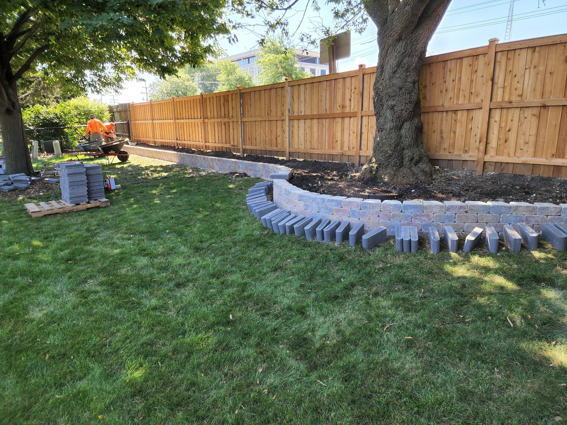 Curved decorative stone border in backyard