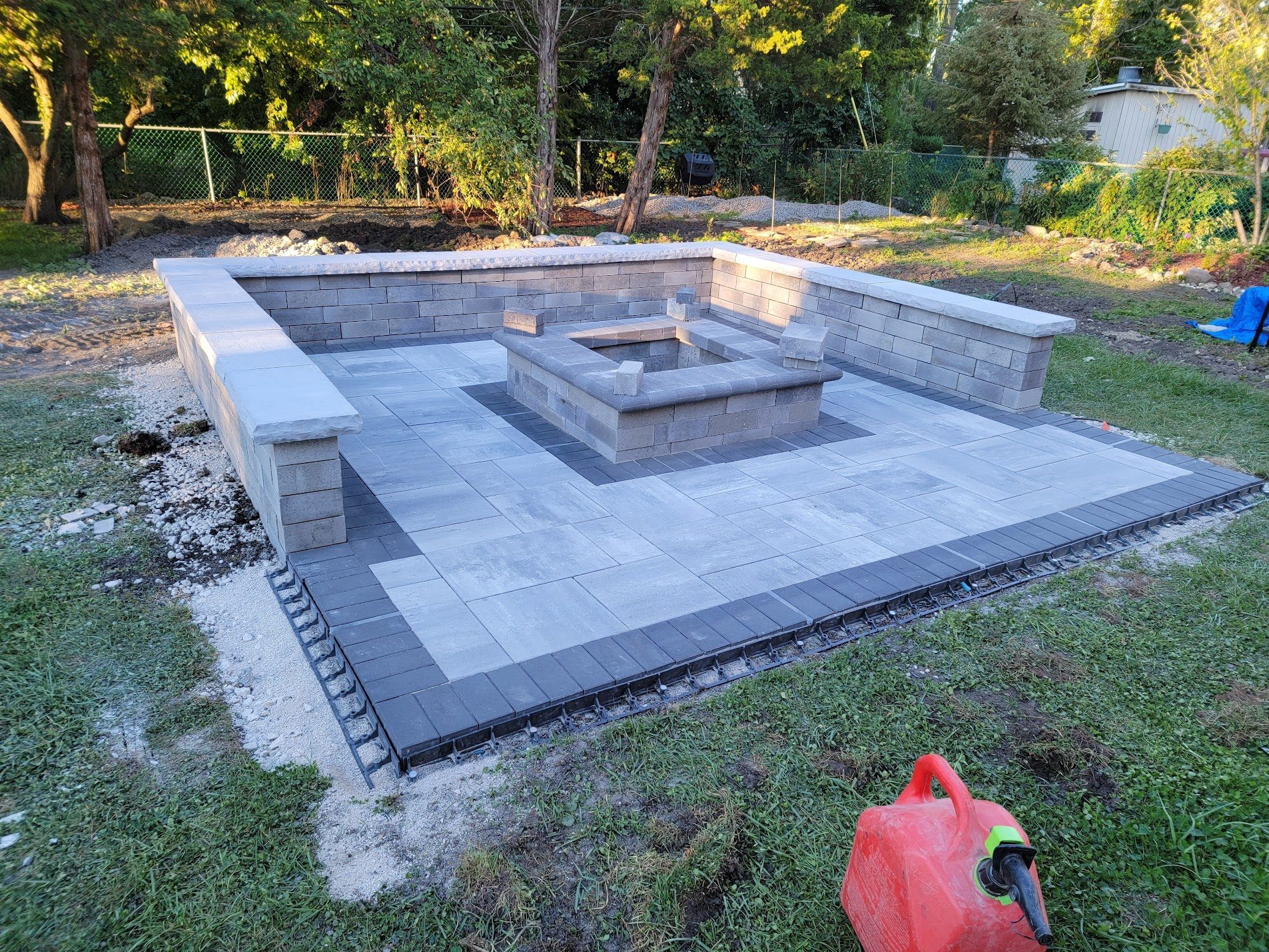 Stamped concrete patio with square sunken fire pit