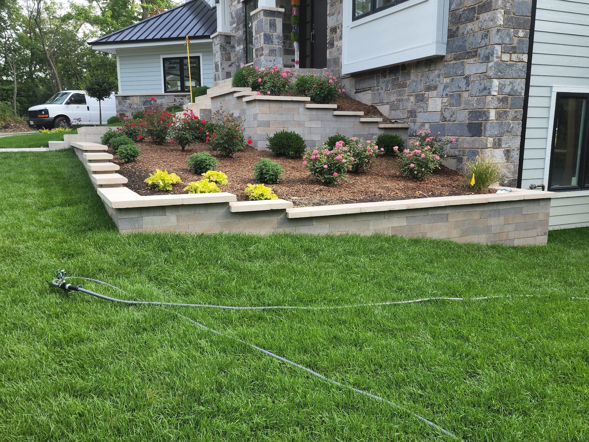 Immaculate lawn with stone-clad home
