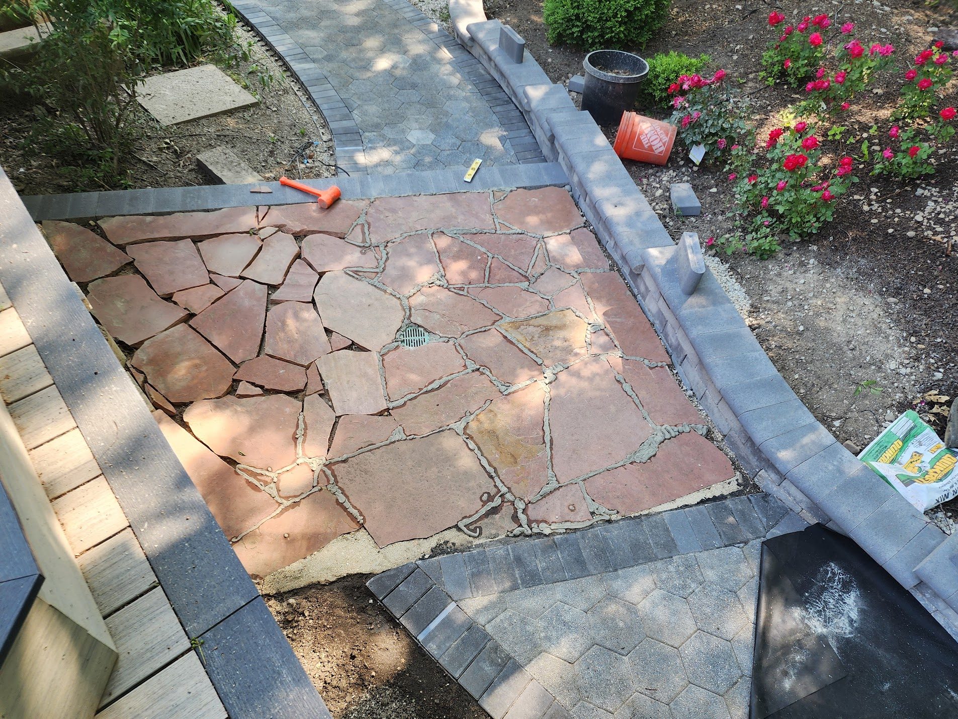 Flagstone walkway bordered by roses
